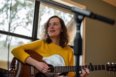 Young Woman Playing Guitar